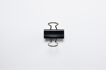 Black binder clip isolated on white background