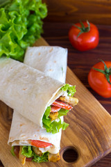 Doner kebab - fried chicken meat with vegetables in pita bread