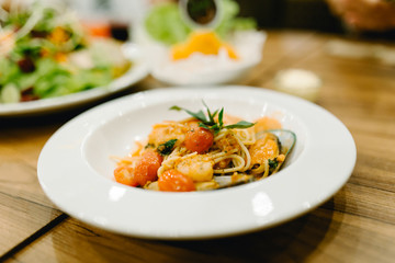 Spaghetti with seafood on the dining table. soft-focus