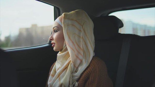 The daily life of a young Muslim woman who rides a taxi for a meeting with a girlfriend, the modern life of an Arab woman who dressed the hijab