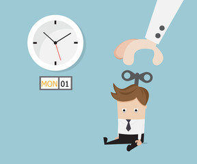 businessman sitting tired with hand turn on wind up