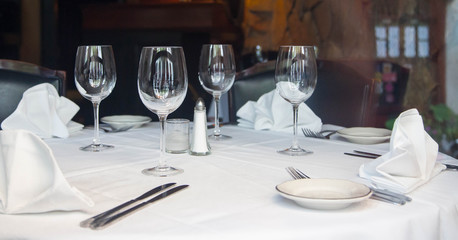 Table Service For Four With Wine Glasses