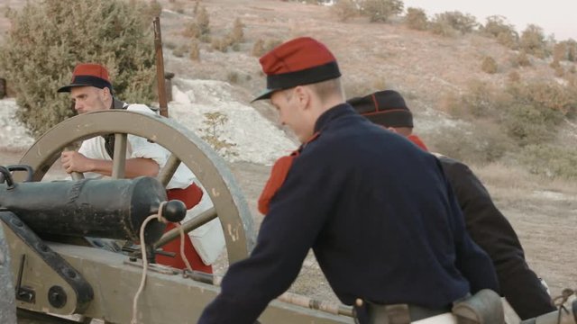 French soldiers rolling the cannon