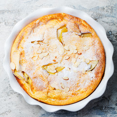Apple dutch pancake, cake in baking dish. Top view