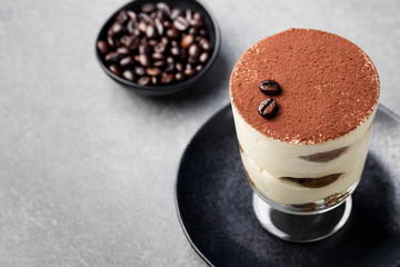 Tiramisu, traditional Italian dessert in glass.
