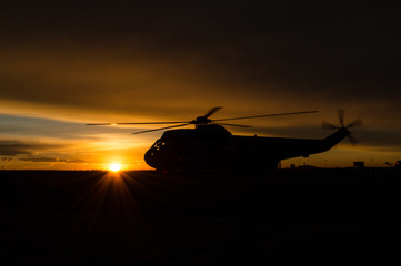 Fototapeta na wymiar Helicopter at sunrise
