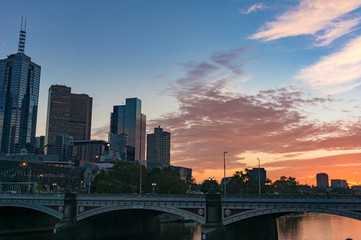 Fototapeta na wymiar Melbourne downtown cityscape with colorful sunrise sky on the background