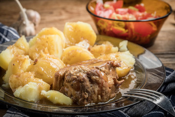 Stewed pork meat served with potatoes