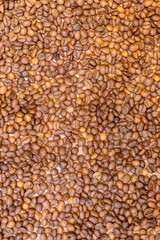 Spilled grains of fragrant coffee close-up. Photo frame, background.