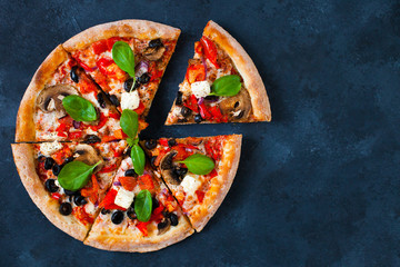 Homemade pizza with tomatoes, mozzarella and basil. Top view with copy space on dark concrete background. - 155110873
