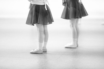 Little children at a rehearsal in a dance studio.