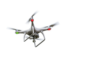 Flying drone, quadrocopter with rotating propellers and action camera for photo and video isolated against a white background, copy space