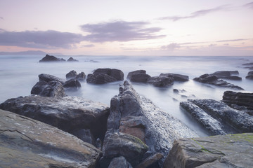Fototapeta na wymiar Serene seascape in Barrika beach, Biscay, Basque Country, Spain. Long exposure shot.