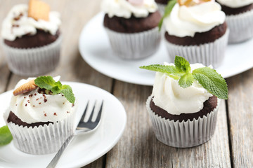 Chocolate cupcakes on a grey wooden table