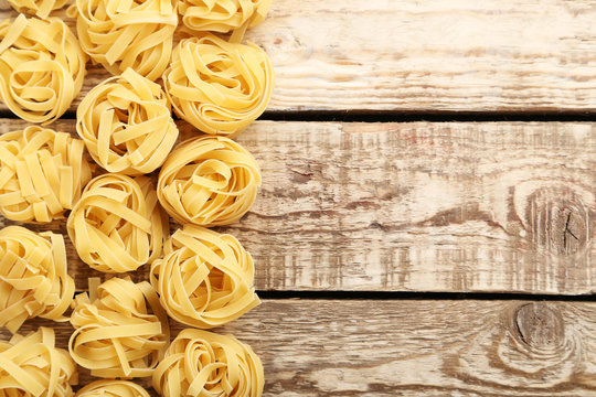 Noodles Pasta On The Brown Wooden Table