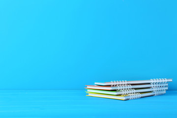 Colorful notebook on blue background