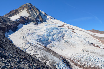Hiking in Oregon. Scenic Eliot Glacier view on Mount Hood from trail to Cooper Spur. USA Pacific...