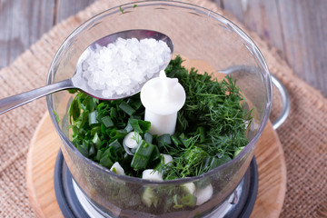 Chopped fresh herbs parsley in a blender