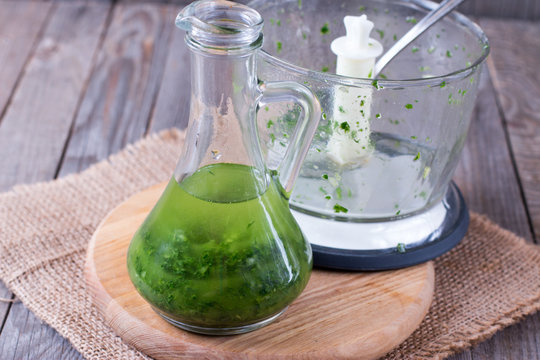 Fresh green oil in a bottle