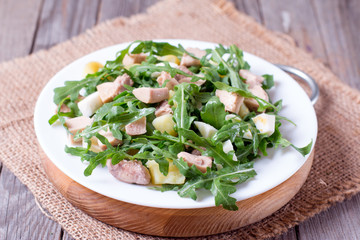 Fresh salad with arugula, egg and tuna