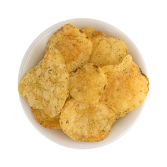 Sour cream and onion flavored potato chips in a bowl top view isolated on a white background.
