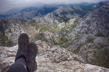 Hiker on Tulove grede, part of Velebit mountain in Croatia. 