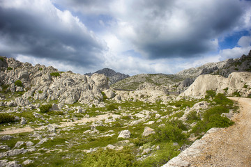 Fototapeta na wymiar Majstorska cesta - macadam road over Velebit mountain, under Tulove grede.