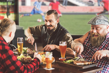 Joyful bearded men having fun together