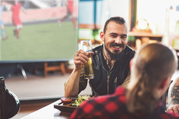 Cute guys enjoying light beer after work