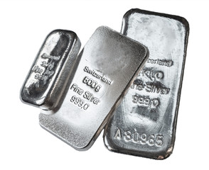 Three cast silver bars isolated on the white background.