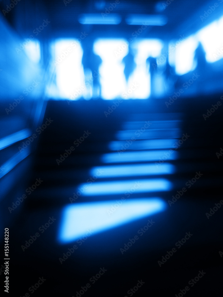 Wall mural Diagonal blue metro station stairs bokeh background