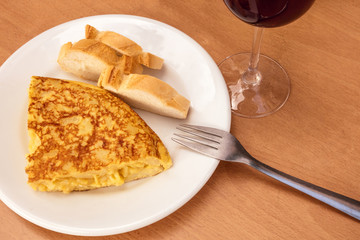 Spanish tortilla with wine, tapas in local bar