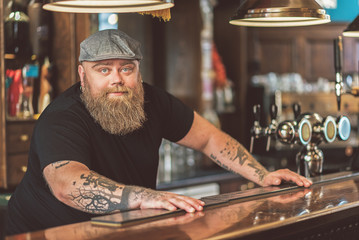 Bearded adult guy working in pub