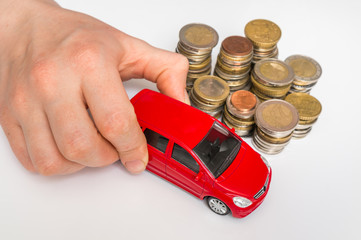 Money and toy car on white - insurance, loan and buying car