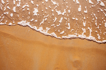 sand beach and waves from above