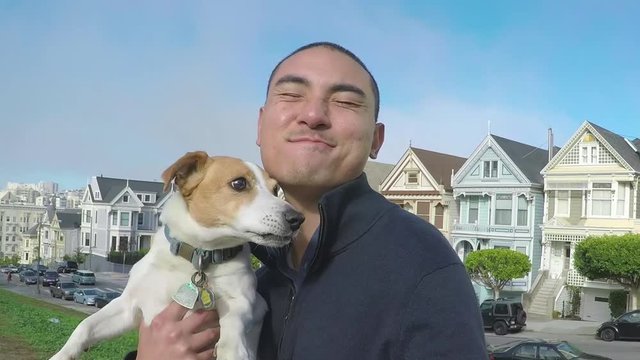 Attractive Asian Man Uses Gopro Stick To Take Portrait With His Dog In San Francisco