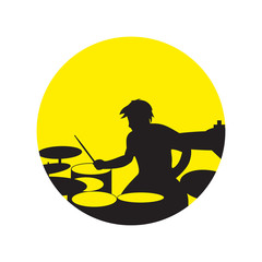 Drummer silhouette on round background