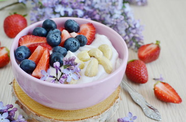 Yogurt with berries and cashew, healthy breakfast