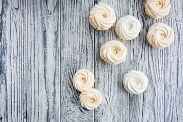 Yellow zephyr on grey wooden background