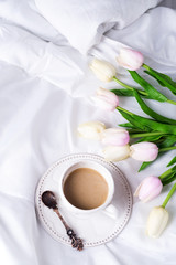 Pink tulips and coffee cup