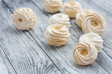 Yellow zephyr on grey wooden background