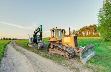 Obraz premium The excavator and bulldozer.