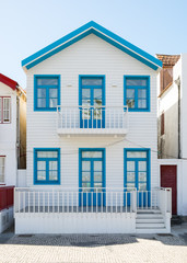 Typical Portuguese architecture, Portuguese colorful wooden house, Colorful facade, Wooden colorful houses in Portugal in Costa Nova