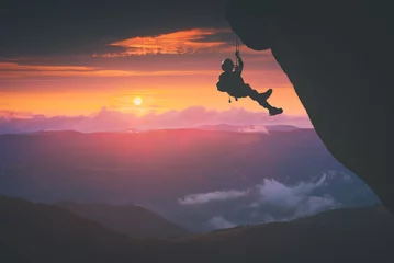 Gardinen Climber against sunset background. Instagram stylisation © Bashkatov