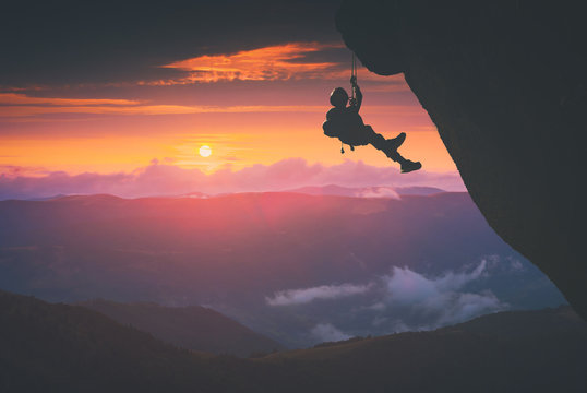 Climber against sunset background. Instagram stylisation