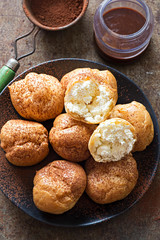 Chocolate cream profiteroles with cocoa