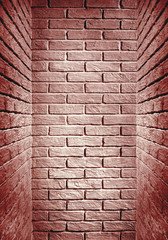 red toned brick wall end of the corridor, abstract background photo