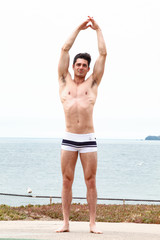 Strong muscular Men, perfect body, abs, six pack, sea, beach, swimwear