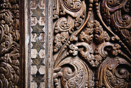 Beautiful wood carving on ancient door in Buddhist temple in Kandy, Sri Lanka.