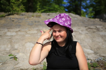 Fototapeta The beautiful  girl in a hat obraz